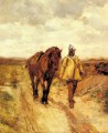 武器を持つ男とその馬